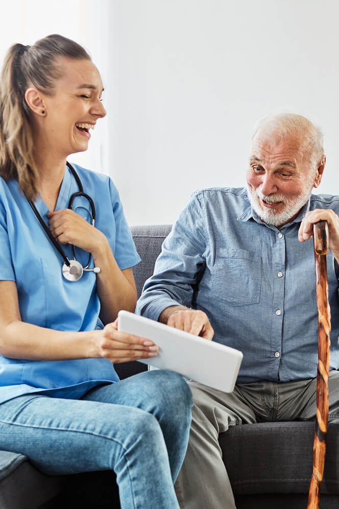 Nurse Comforting Elderly Woman at Nursing Home Colleyville
