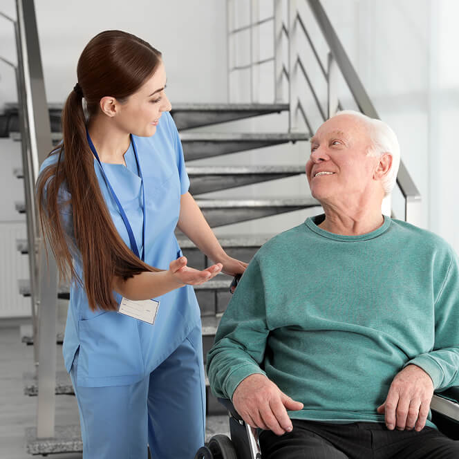 Caregiver Comforting Resident at Memory Care Facility